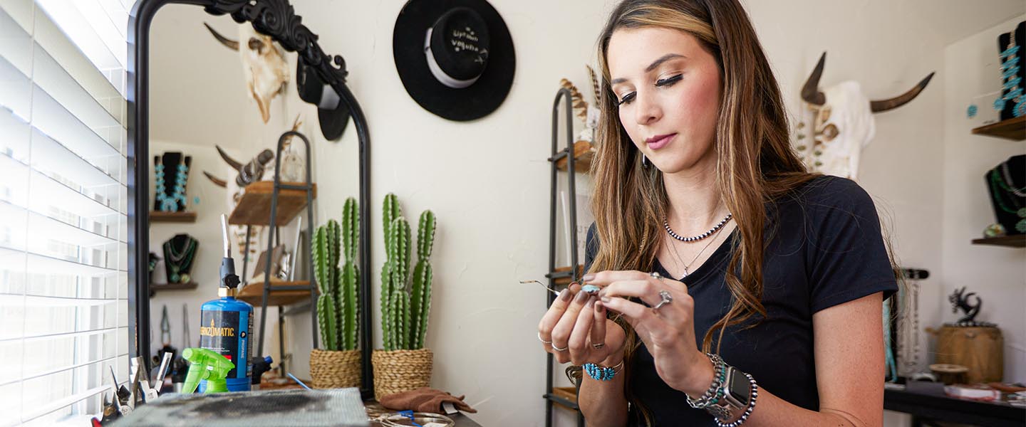 Regan making jewelry in studio 